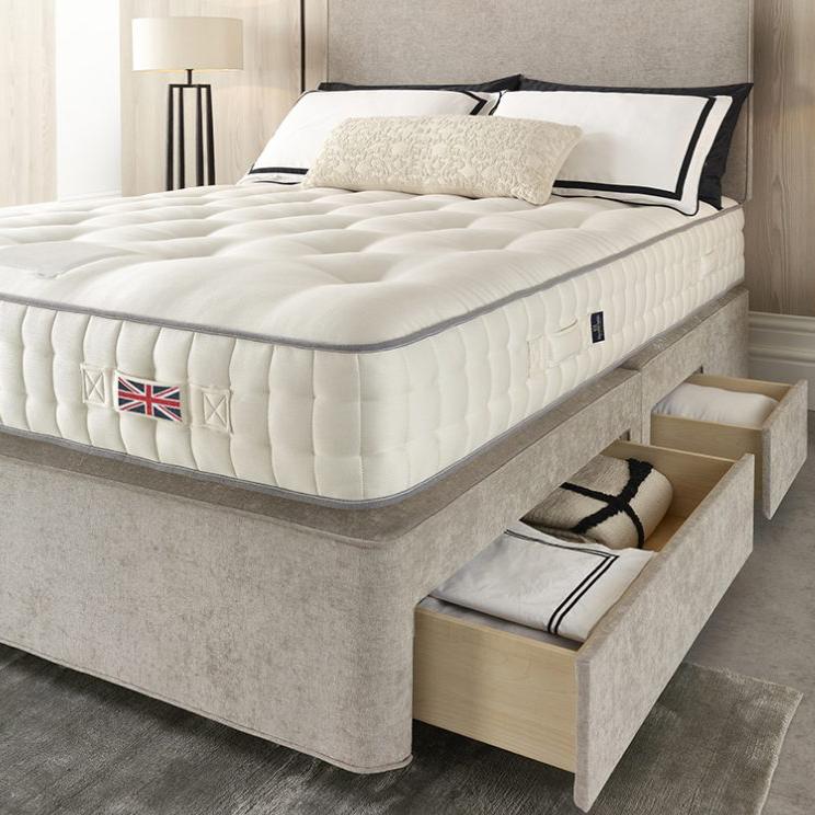 Harrison Spinks Euston mattress close-up with divan drawers open.
