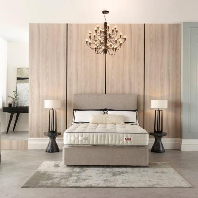 The Harrison Spinks Euston Mattress in a styled bedroom on a divan with headboard.